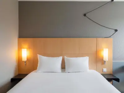 Un ou plusieurs lits dans un hébergement de l'établissement ibis Cergy Pontoise Le Port