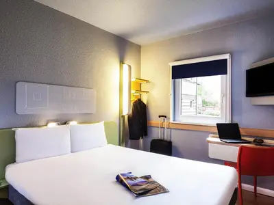 Télévision ou salle de divertissement dans l'établissement Ibis Budget Cergy St Christophe