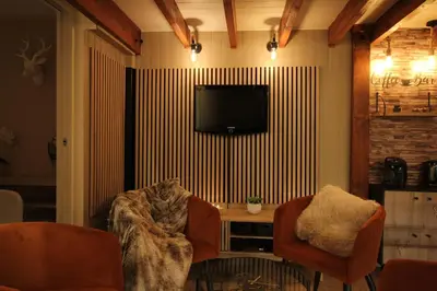 Télévision ou salle de divertissement dans l'établissement Le clos des charmelines