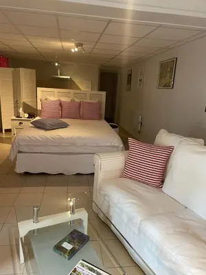 Un ou plusieurs lits dans un hébergement de l'établissement Rose Garden Studio