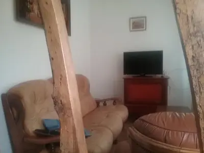 Télévision ou salle de divertissement dans l'établissement Gite a la ferme