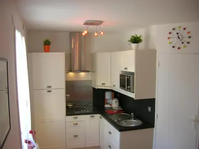 Cuisine ou kitchenette dans l'établissement Gite A
