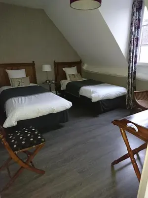 Un ou plusieurs lits dans un hébergement de l'établissement Côté Jardin - Chambres d'hôtes