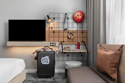 Télévision ou salle de divertissement dans l'établissement Moxy Amiens