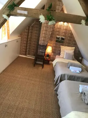Un ou plusieurs lits dans un hébergement de l'établissement Charmante Maison entre les Pommiers