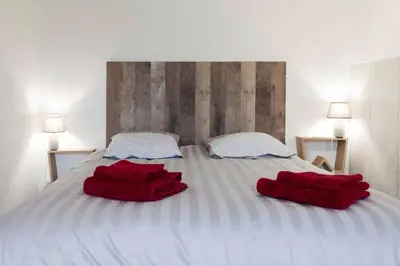Un ou plusieurs lits dans un hébergement de l'établissement La Dimière - Appartements de standing en hyper-centre - Louviers