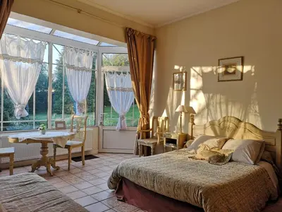 Un ou plusieurs lits dans un hébergement de l'établissement Le Domaine des Prés du Hom