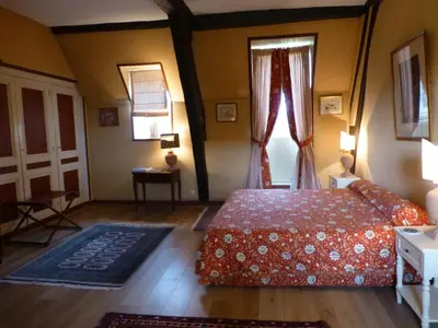 Un ou plusieurs lits dans un hébergement de l'établissement Chambres d'Hôtes de Manoir de Captot