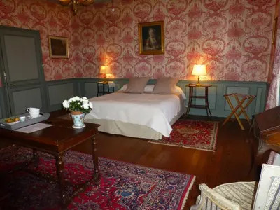 Un ou plusieurs lits dans un hébergement de l'établissement Chambres d'Hôtes de Manoir de Captot