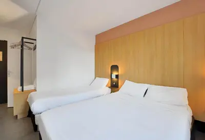 Un ou plusieurs lits dans un hébergement de l'établissement B&B HOTEL Le Tréport Friville