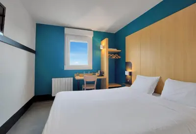Un ou plusieurs lits dans un hébergement de l'établissement B&B HOTEL Le Tréport Friville