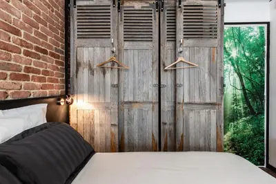Un ou plusieurs lits dans un hébergement de l'établissement Suite Vintage Rouen