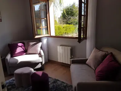 Coin salon dans l'établissement Le Clos Magedon