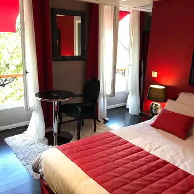 Un ou plusieurs lits dans un hébergement de l'établissement Hotel l'Avenue