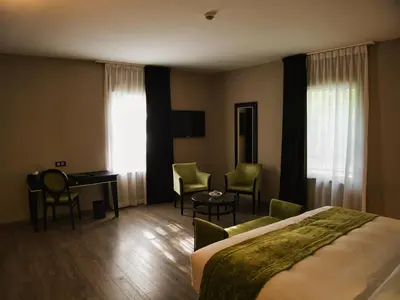 Un ou plusieurs lits dans un hébergement de l'établissement Amicitia - Hôtel & Restaurant