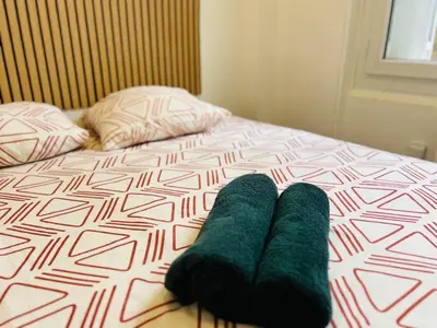 Un ou plusieurs lits dans un hébergement de l'établissement Cosy Immo Key - Chambly Persan Roissy