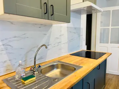 Cuisine ou kitchenette dans l'établissement Cosy Immo Key - Chambly Persan Roissy
