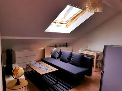 Coin salon dans l'établissement Cosy Immo Key - Chambly Persan Roissy