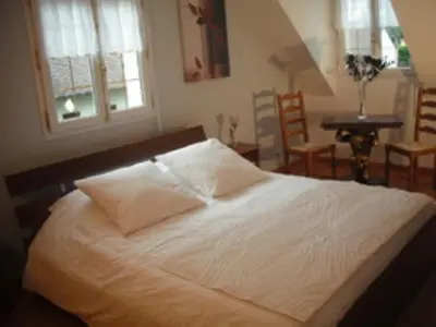 Un ou plusieurs lits dans un hébergement de l'établissement Les chambres du lac
