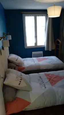 Un ou plusieurs lits dans un hébergement de l'établissement Le 76