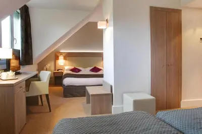 Un ou plusieurs lits dans un hébergement de l'établissement Best Western Plus Hotel Du Parc Chantilly