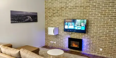 Télévision ou salle de divertissement dans l'établissement Appart'HomeCity - Rouen Grand Voile