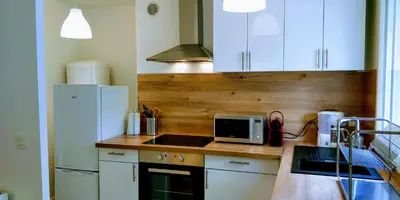 Cuisine ou kitchenette dans l'établissement Appart'HomeCity - Rouen Grand Voile