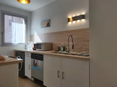 Cuisine ou kitchenette dans l'établissement Appart'HomeCity - Rouen Vauban