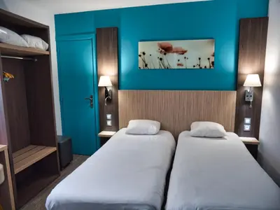 Un ou plusieurs lits dans un hébergement de l'établissement Contact Hotel Le Seino Marin - Cléon Elbeuf Rouen