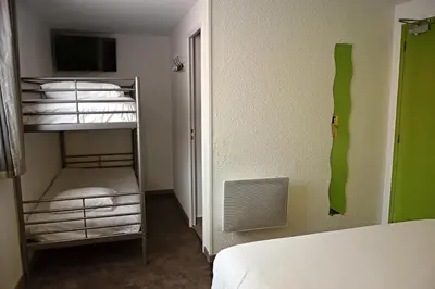 Un ou plusieurs lits dans un hébergement de l'établissement Contact Hotel Le Seino Marin - Cléon Elbeuf Rouen