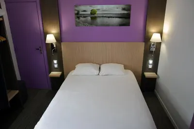 Un ou plusieurs lits dans un hébergement de l'établissement Contact Hotel Le Seino Marin - Cléon Elbeuf Rouen