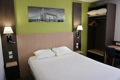 Un ou plusieurs lits dans un hébergement de l'établissement Contact Hotel Le Seino Marin - Cléon Elbeuf Rouen