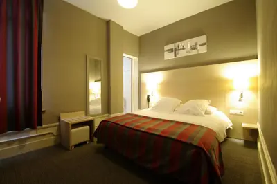 Un ou plusieurs lits dans un hébergement de l'établissement Grand Hotel de L'Univers
