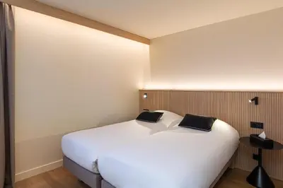 Un ou plusieurs lits dans un hébergement de l'établissement Grand Hôtel De La Seine