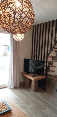 Télévision ou salle de divertissement dans l'établissement la grange