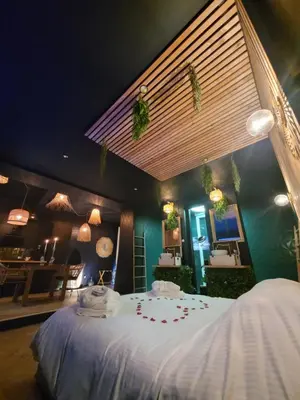 Un ou plusieurs lits dans un hébergement de l'établissement L'escapade Romantique