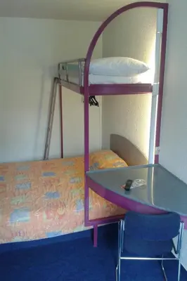 Un ou plusieurs lits dans un hébergement de l'établissement EGG HOTEL - HOTEL LES GENS DE MER Dieppe