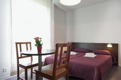 Un ou plusieurs lits dans un hébergement de l'établissement Residhotel Les Hauts d'Andilly