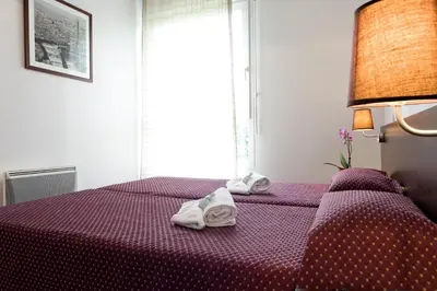 Un ou plusieurs lits dans un hébergement de l'établissement Residhotel Les Hauts d'Andilly