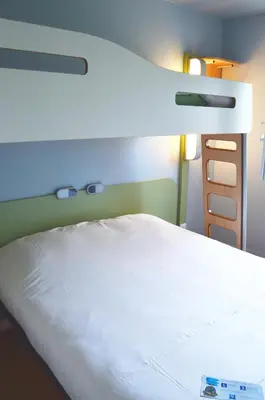 Un ou plusieurs lits dans un hébergement de l'établissement ibis budget Rouen Nord Isneauville