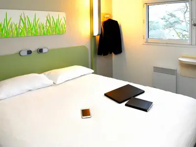 Un ou plusieurs lits dans un hébergement de l'établissement ibis budget Rouen Nord Isneauville