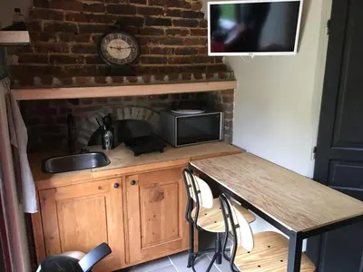 Cuisine ou kitchenette dans l'établissement La maison du bonheur 