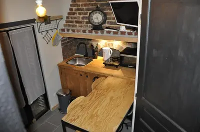 Cuisine ou kitchenette dans l'établissement La maison du bonheur 