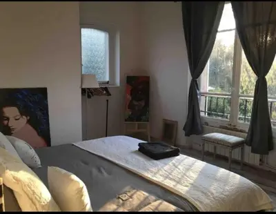 Un ou plusieurs lits dans un hébergement de l'établissement Le Manoir