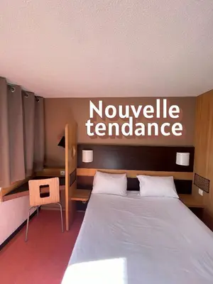 Un ou plusieurs lits dans un hébergement de l'établissement Premiere Classe Amiens Est - Glisy