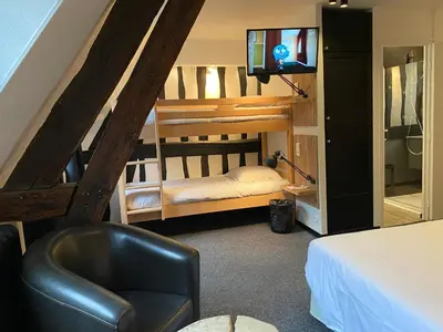 Un ou plusieurs lits dans un hébergement de l'établissement Hôtel De La Cathédrale