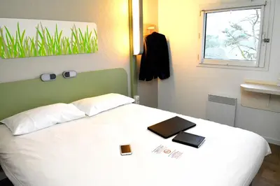Un ou plusieurs lits dans un hébergement de l'établissement ibis budget Rouen Parc des Expos Zenith
