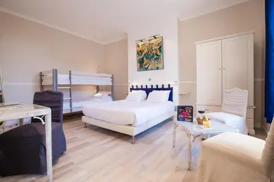Un ou plusieurs lits dans un hébergement de l'établissement Chenal Hotel
