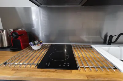 Cuisine ou kitchenette dans l'établissement La Dimiere - Le Postel - Appartements de standing en hyper-centre - Louviers