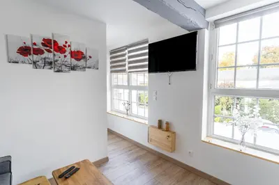 Télévision ou salle de divertissement dans l'établissement La Dimiere - Le Postel - Appartements de standing en hyper-centre - Louviers